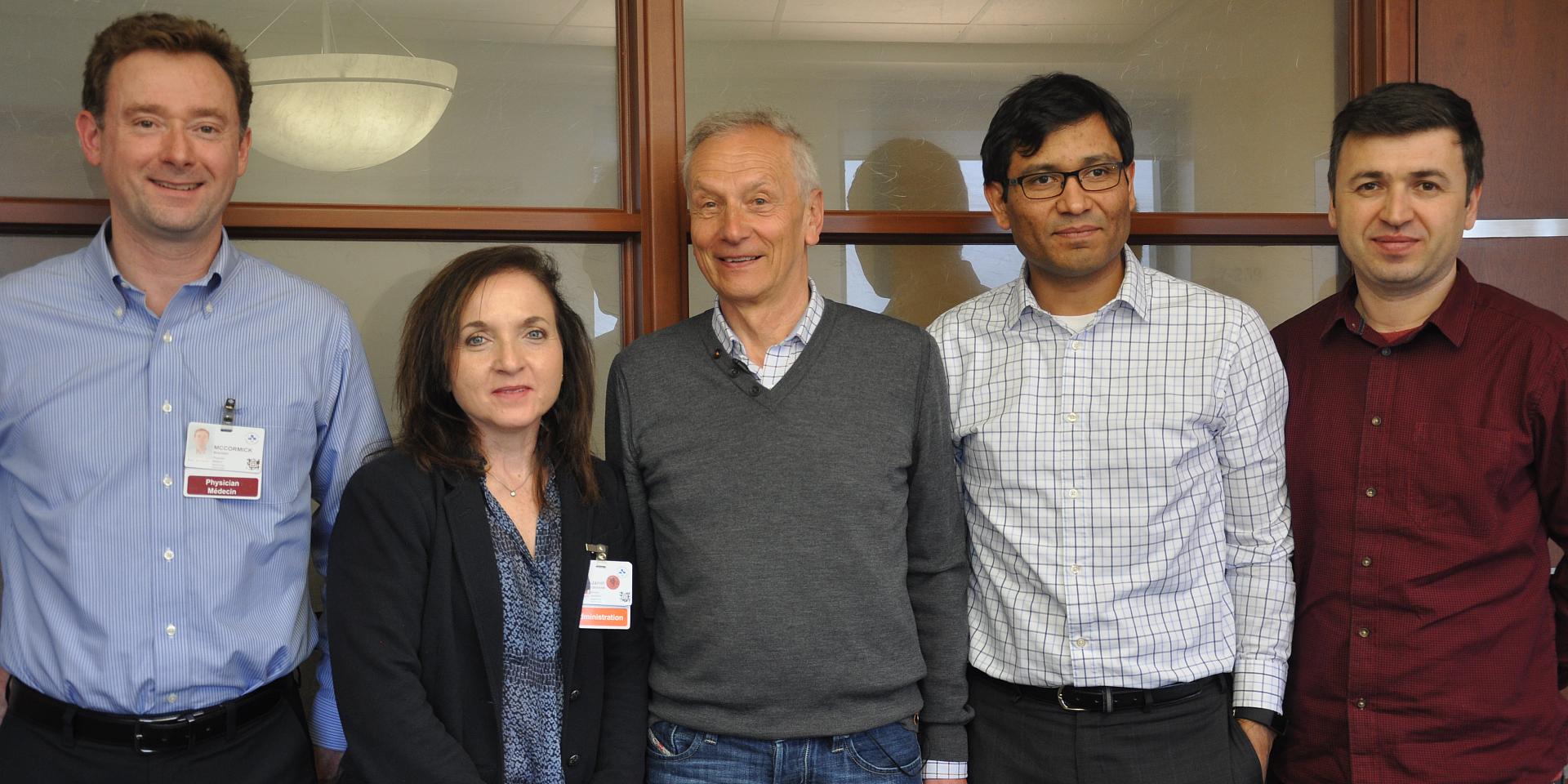 Dr Brendan McCormick, Janet Graham, Wojtek Michalowski, Antoine Sauré and Ahmet Kandakoglu smile for a photo.