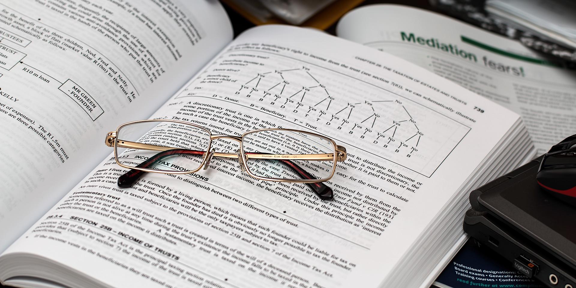 Photo of book and glasses