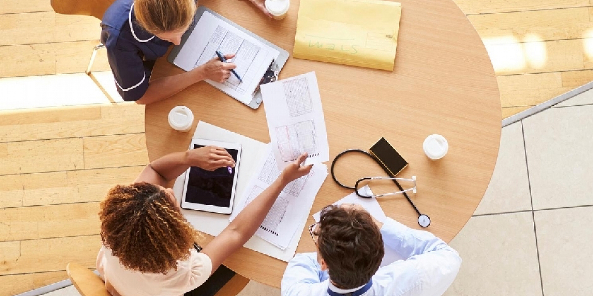 Health professionals working on a roundtable