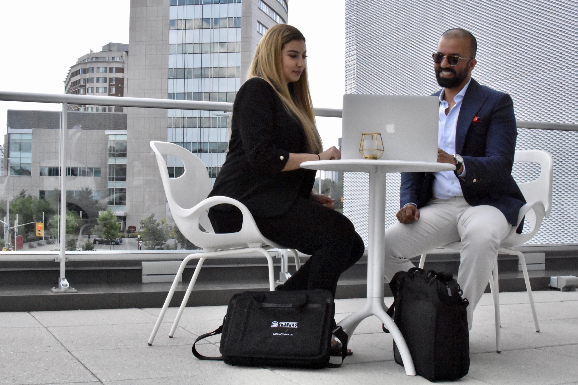 Man and woman wearing masks during a meeting