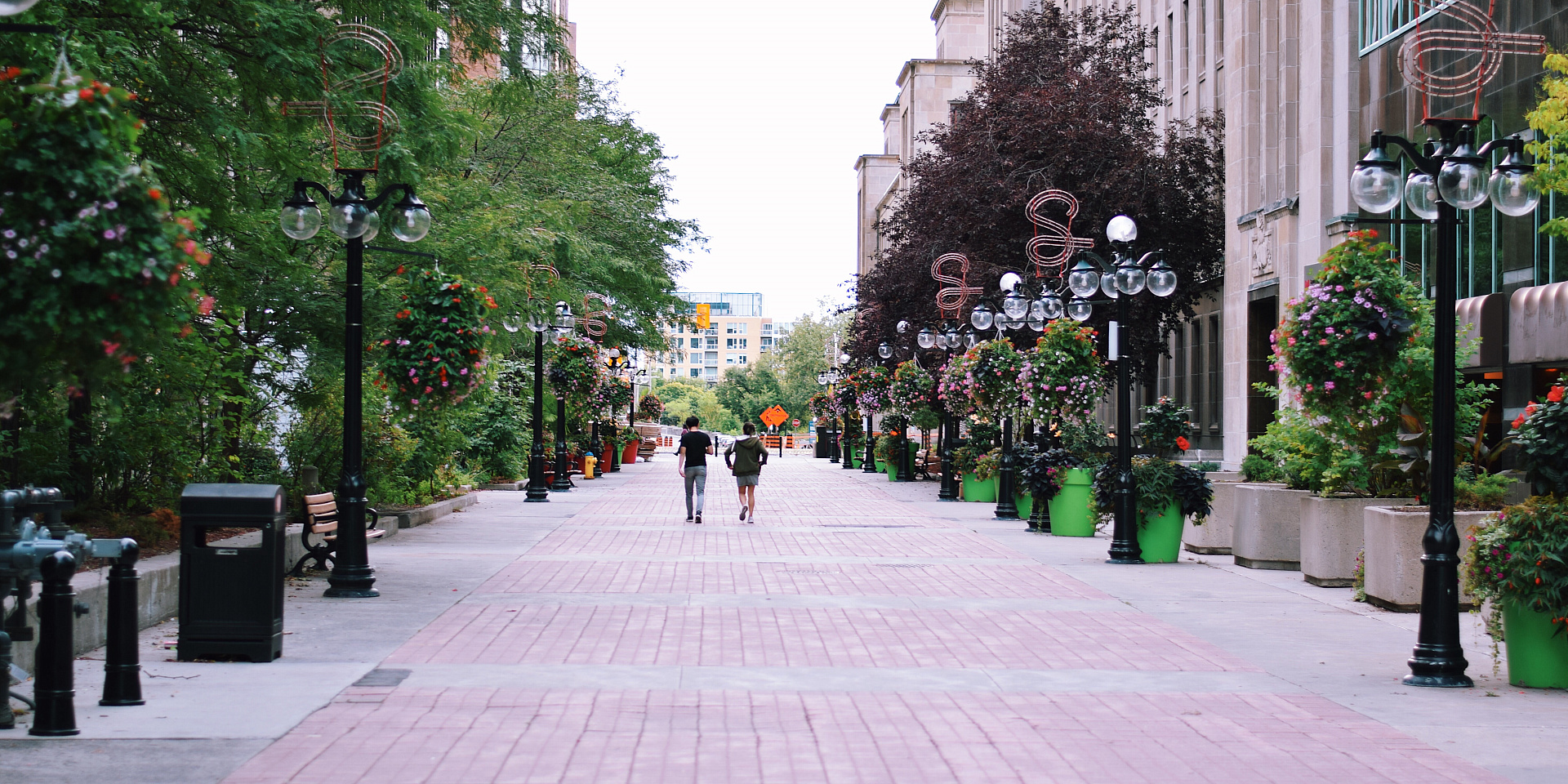 Two people walking on Sparks Street in downtown Ottawa