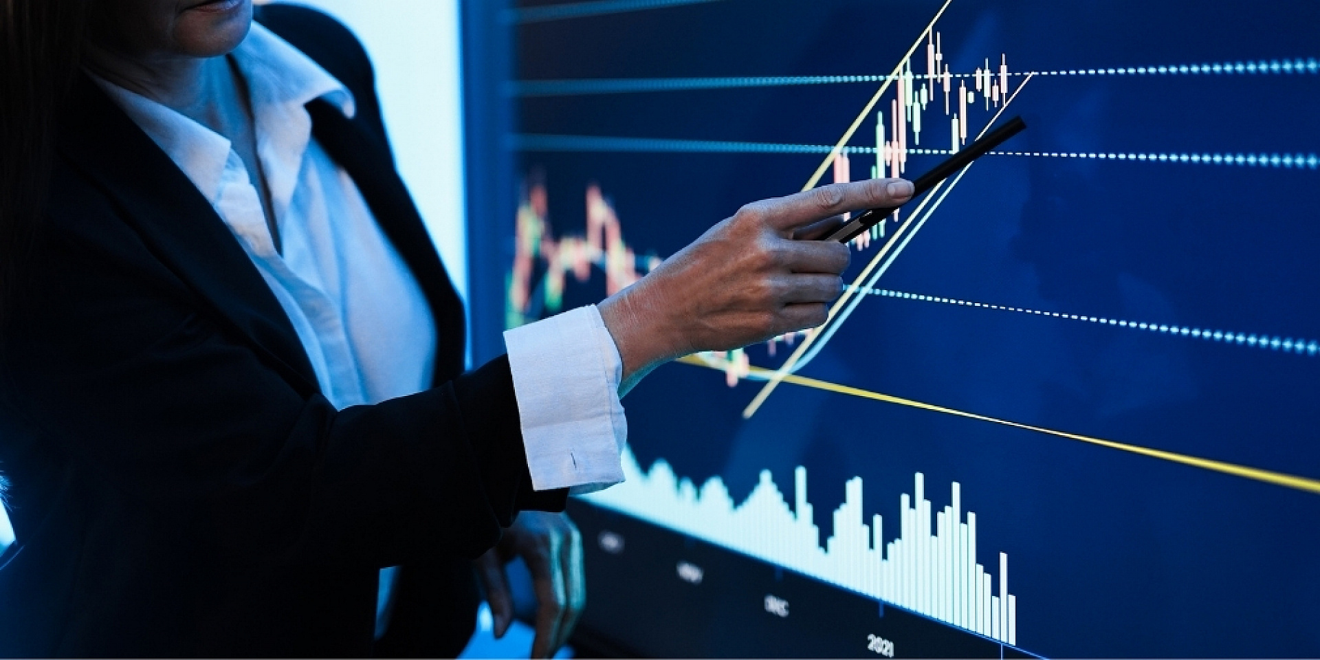 Woman from stock market conducting a meeting in a bank